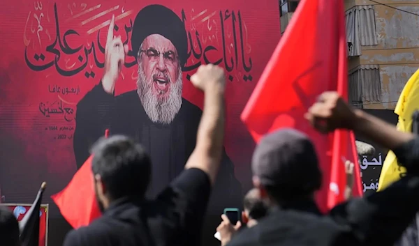 Hezbollah leader Sayyed Hassan Nasrallah spoke via a video call link, during the Shiite holy day of Ashoura, the southern suburb of Beirut, Lebanon, August 9, 2022. (AP)