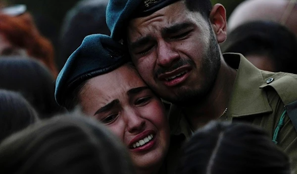 Israeli soldiers cry during the funeral of an Israeli sergeant, "Kibbutz", "Israel", October 23 2023 (AP)