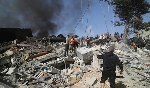 Palestinians look for survivors of the Israeli bombardment of the Gaza Strip in Rafah on Monday, Oct. 23, 2023. (AP)