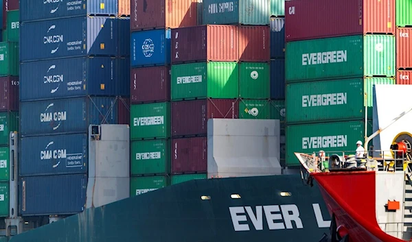 Shipping containers are seen stacked on the Evergreen terminal at the Port of Los Angeles in San Pedro, Calif., Tuesday, Nov. 30, 2021. (AP)