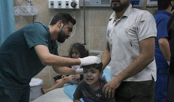 A Palestinian boy, wounded in Israeli airstrike on Gaza, Oct. 21, 2023 (AP)