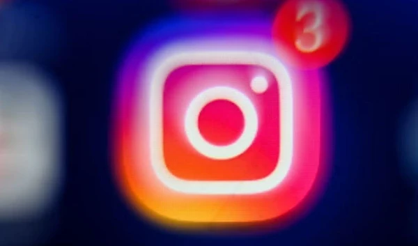 An undated image shows Instagram logo on a phone. (AFP via Getty Images)