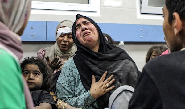 Palestinian mom and her children at Gaza's al-Shifa hospital after surviving the massacre of al-Ahli hospital committed by ‘Israel’.