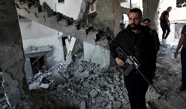 Palestinians inspect the damage after an Israeli strike hit a compound beneath a mosque in Jenin refugee camp, occupied West Bank, Palestine, Oct. 22, 2023 (AP)