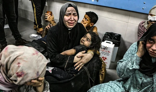 Wounded Palestinians sit in al-Shifa hospital in Gaza City after sustaining injuries due to the brutal Israeli airstrikes on Oct. 17, 2023. (AP)