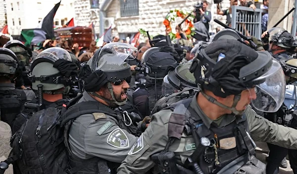 Israeli security forces clashing with funeral attendees of slain journalist Shireen Abu Akleh (AFP)