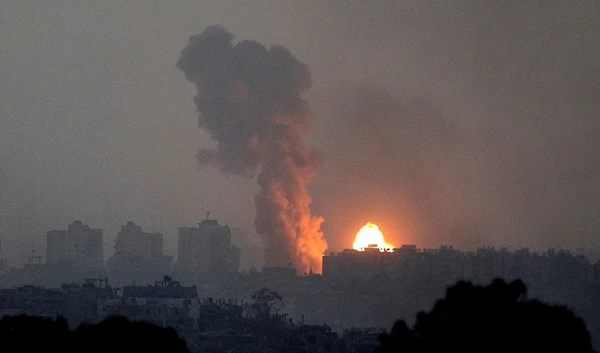 Fire and smoke rise following an Israeli occupation airstrike in the Gaza Strip, as seen from outside the strip, Occupied Palestine, Saturday, Oct. 28, 2023. (AP)