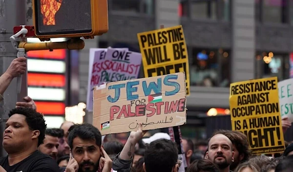 Demonstrators last week gathered in Manhattan's Times Square to voice support for the Palestinian people and urge against continued US military aid to "Israel" (AFP)