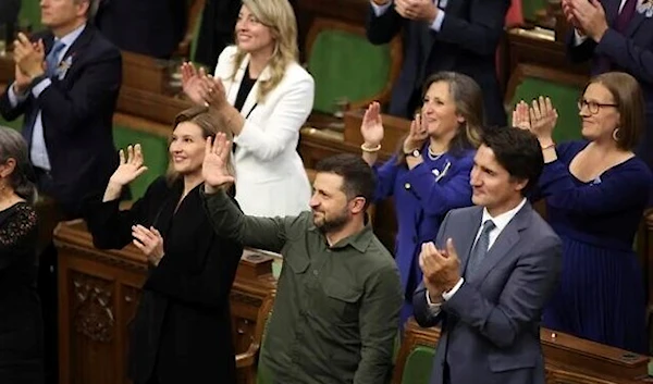 Ukrainian President Volodymyr Zelensky and Prime Minister Justin Trudeau join a standing ovation for Yaroslav Hunka, who was in attendance in the House of Commons in Ottawa, Ontario, on September 22, 2023. (AP)