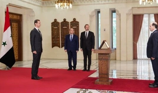 Mohammad Mohammad takes his oath sworn as Syrian Ambassador in Tunisia. (SANA)