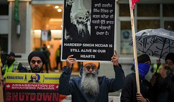 People protest outside the Indian Consulate, in Vancouver, British Columbia, on September 25, 2023. (AP)