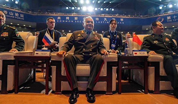 Russian Defense Minister Sergei Shoigu, center, takes a seat for the opening ceremony of the 10th Beijing Xiangshan Forum in Beijing, Monday, Oct. 30, 2023. (AP)