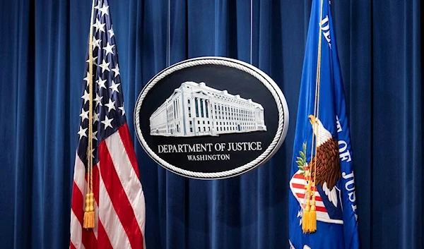 This Jan. 12, 2021, file photo shows a sign for the Department of Justice ahead of a news conference in Washington. (Sarah Silbiger/Pool via AP, File)