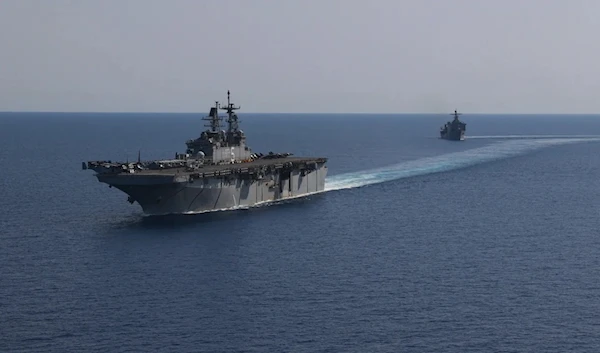 File photo released by the US Navy showing the amphibious assault ship USS Bataan, front, and the landing ship USS Carter Hall in the Red Sea in August 2023.