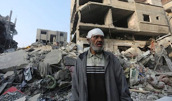 A Palestinian stands outside the building destroyed in an Israeli airstrike in the Gaza Strip in Rafah, Wednesday, Oct 25, 2023. (AP)