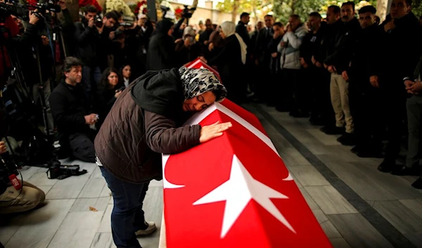 Relatives and friends of Arzu Ozsoy and her 15-year-old daughter Yagmur Ucar, who died in Sunday's explosion occurred on Istiklal avenue, attend their funeral in Istanbul, Turkey, on Nov. 14, 2022. (AP)