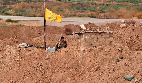 SDF fighter stands guard at the Syrian side of the border with Iraq near Rabiaa border crossing, Iraq, Wednesday, October 16, 2019 (AP)