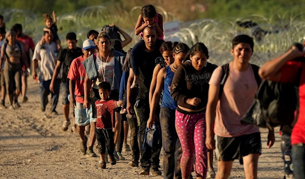 Migrants who crossed the Rio Grande and entered the U.S. from Mexico are moved for processing by U.S. Customs and Border Protection, Saturday, Sept. 23, 2023, in Eagle Pass, Texas. (AP Photo/Eric Gay)