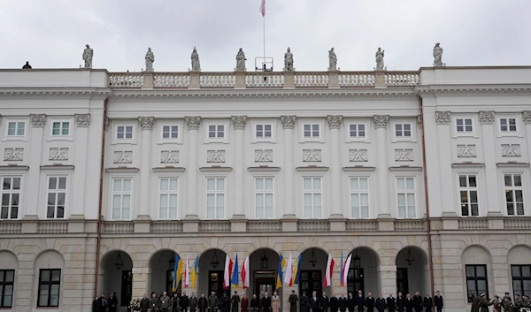 Poland's President Andrzej Duda welcomes Ukrainian President Volodymyr Zelenskyy as they meet at the Presidential Palace in Warsaw, Poland, Wednesday, April 5, 2023. (AP Photo/Czarek Sokolowski)