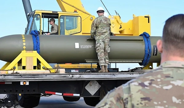 In this photo released by the U.S. Air Force on May 2, 2023, airmen look at a GBU-57, or the Massive Ordnance Penetrator bomb, at Whiteman Air Base in Missouri (U.S. Air Force via AP)