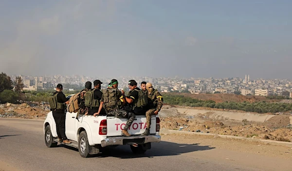 Palestinian Resistance fighters advancing toward the Israeli Erez checkpoint at the separation fence, October 7, 2023. (AFP via Getty Images)