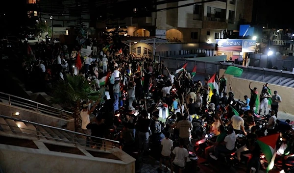 Palestinian youth pay tribute to Al Mayadeen News Network and celebrate Operation Al-Aqsa Flood in front of the networks building on Sunday, October 8, 2023. (Al Mayadeen)