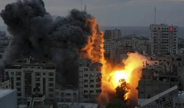 256 Palestinians martyred in Israeli on GazaA ball of fire and smoke rise from an explosion on a Palestinian apartment tower following an Israeli air strike in Gaza City, Saturday, Oct. 7, 2023. (AP)