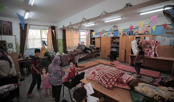 An UNRWA school is pictured sheltering displaced families in the GazaStrip. (Twitter)