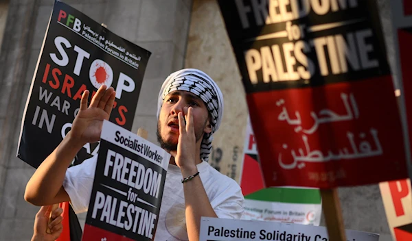 People take part in a 'Stand with Palestine' demonstration, close to the Embassy of Israel, in west London on October 9, 2023. (Photo by Daniel LEAL / AFP)