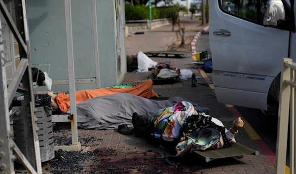 Dead Israeli settlers lie covered in Sderot, Israel, on Saturday, Oct. 7, 2023. (AP)