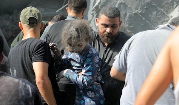 . A little child pulled from under the rubble in the wake of the 	Israeli massacre in in the Jabalia refugee camp, north of the #Gaza Strip on October 31, 2023. (Twitter)