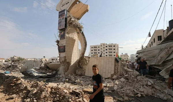 A Palestinian boy surveys the massive destruction following the Israeli military's raid in Jenin. ( AFP)