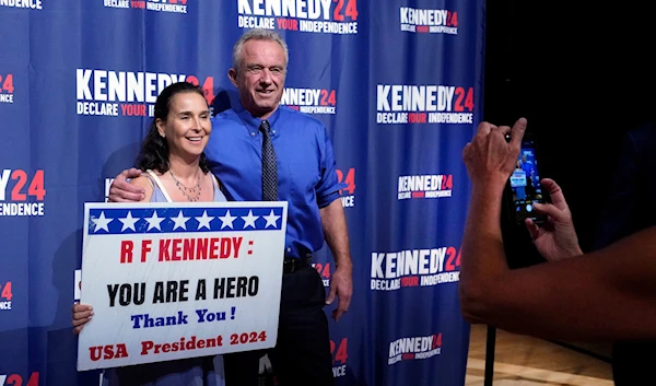 poses for a photo with presidential candidate Robert F. Kennedy Jr., on Oct. 12, 2023, in Miami, Fla. (AP)