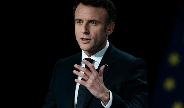 French President Emmanuel Macron delivers his speech during a presidential campaign news conference in Aubervilliers, north of Paris, France, Thursday, March 17, 2022. (AP)