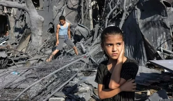 Palestinian children inspect their home after an Israeli airstrike reduced it to rubble (AFP via Getty Images)