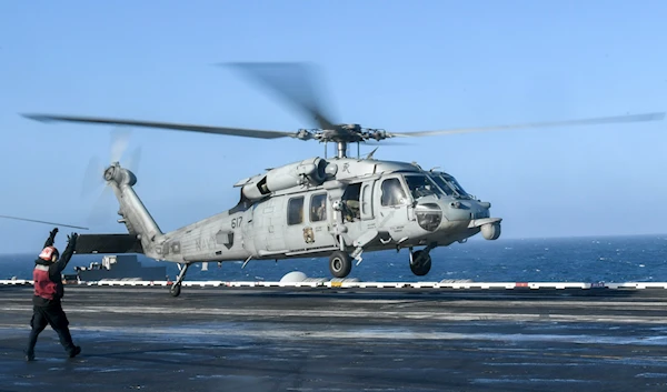 An MH-60S Knighthawk, assigned to the ‘Eightballers’ of Helicopter Sea Combat Squadron (HSC) 8, takes off from the flight deck of the aircraft carrier USS Theodore Roosevelt (CVN-71) on May 20, 2021 (US Navy Photo)