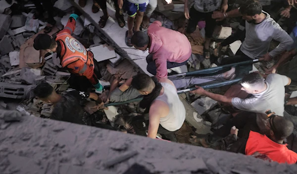 Palestinians evacuate a wounded man following an Israeli airstrike in Khan Younis refugee camp, southern Gaza Strip, Monday, Nov. 13, 2023. (AP Photo/Mohammed Dahman)