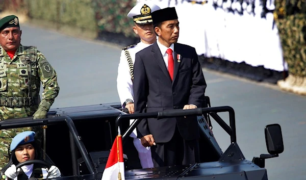 Indonesian President Joko Widodo inspect the troops during a parade marking the 72nd anniversary of the Indonesian Armed Forces in Cilegon, Banten, Indonesia, Thursday, Oct. 5, 2017 (AP)