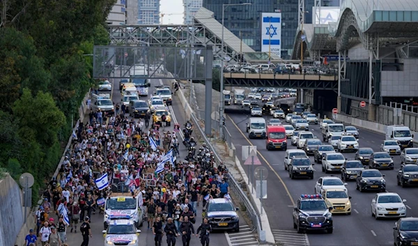 Families and friends of Israeli captives held by Hamas in Gaza call for their return in march from Tel Aviv to the Prime Minister's Office in al-Quds, occupied Palestine, Tuesday, Nov. 14, 2023. (AP)(