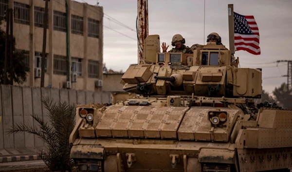 US occupation soldiers patrol in Hassakeh, Syria, Tuesday, Feb. 8, 2022. (AP)