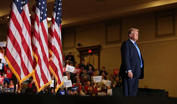 Former President Donald Trump waves to the crowd at a campaign rally on Nov. 11, 2023, in Claremont, New Hampshire. (AP)