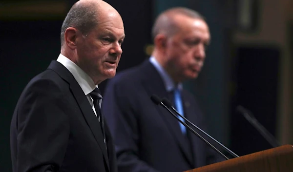 Turkish President Recep Tayyip Erdogan and Germany's Chancellor Olaf Scholz speak to the media after their talks, in Ankara, Turkey, Monday, March 14, 2022 (AP)