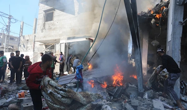 Palestinians look for survivors after an Israeli strike on Rafah, Gaza Strip, Friday, Nov. 17, 2023 (AP Photo/Hatem Ali)