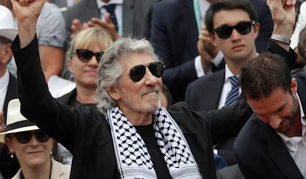 British musician and member of the Pink Floyd band Roger Waters presents the trophy of the men's final match of the French Open tennis tournament in Paris, France on June 10, 2018. (AP)