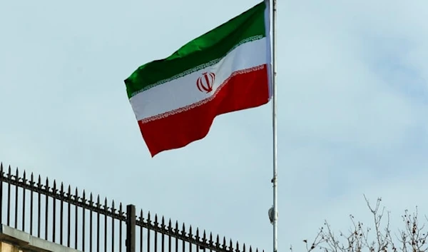 The Iranian national flag flies at half staff in sign of mourning, Jan. 4, 2020 (AP)