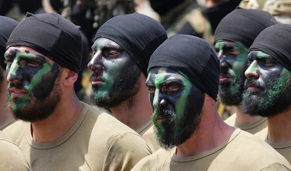 Fighters from the Lebanese Hezbollah Resistance group carry out a training exercise in Aaramta village in the Jezzine District, southern Lebanon, May 21, 2023 (AP)