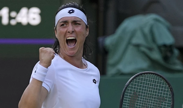 Ons Jabeur celebrates after winning a point against Marie Bouzkova in the Wimbledon women's singles quarterfinal, London, England, July 5, 2022. (AP)