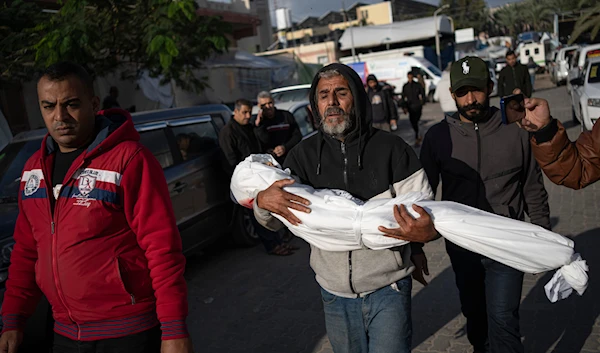 Palestinians mourn their relatives killed in the Israeli bombardment of the Gaza Strip, in the hospital in Khan Younis, Tuesday, Nov. 21, 2023. (AP)