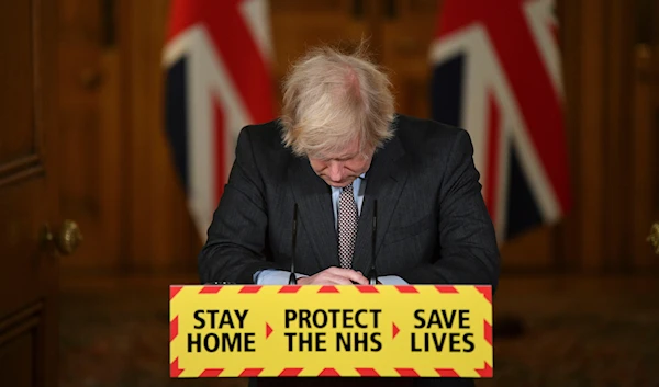 Britain'sPrime Minister Boris Johnson reacts while leading a virtual news conference on the COVID-19 pandemic, inside 10 Downing Street in central London on Jan. 26, 2021. (AP)