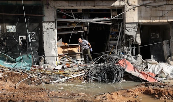 A man stands in front of his store as he surveys the destruction following Israeli military’s raid in Jenin on October 30. (AFP)